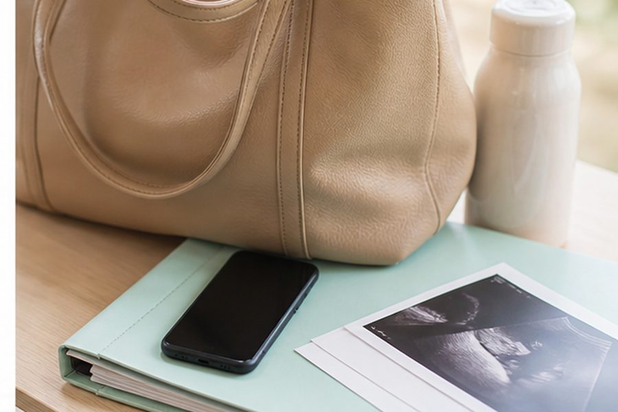 Prepared maternity bag, phone and pregnancy records